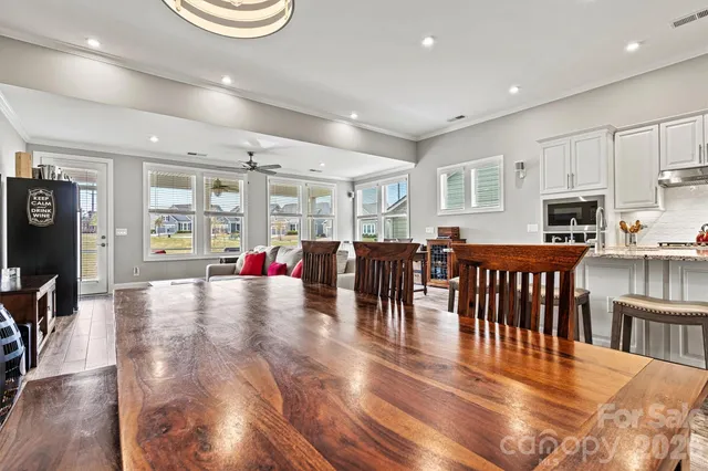 a view of kitchen and dining room with wooden floor
