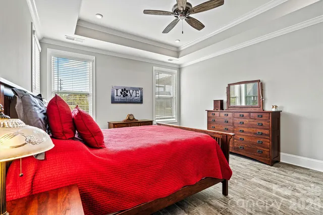 a bedroom with a bed and dresser