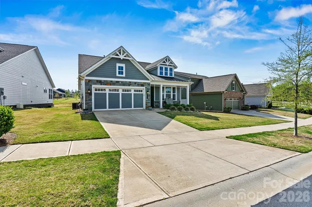 a view of house with yard in front of it