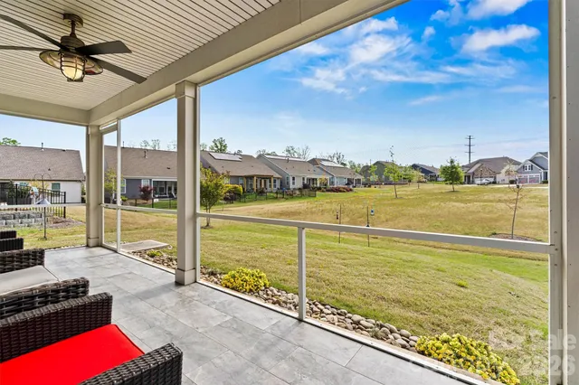 a view of a living room and floor to ceiling window