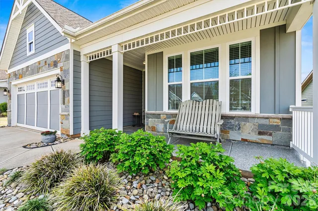 front view of a house with a bench