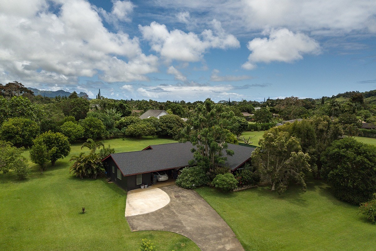 6164 Holio Road Kapaa, HI 96746 - Photo 5 of 8 an aerial view of a house with garden space and street view