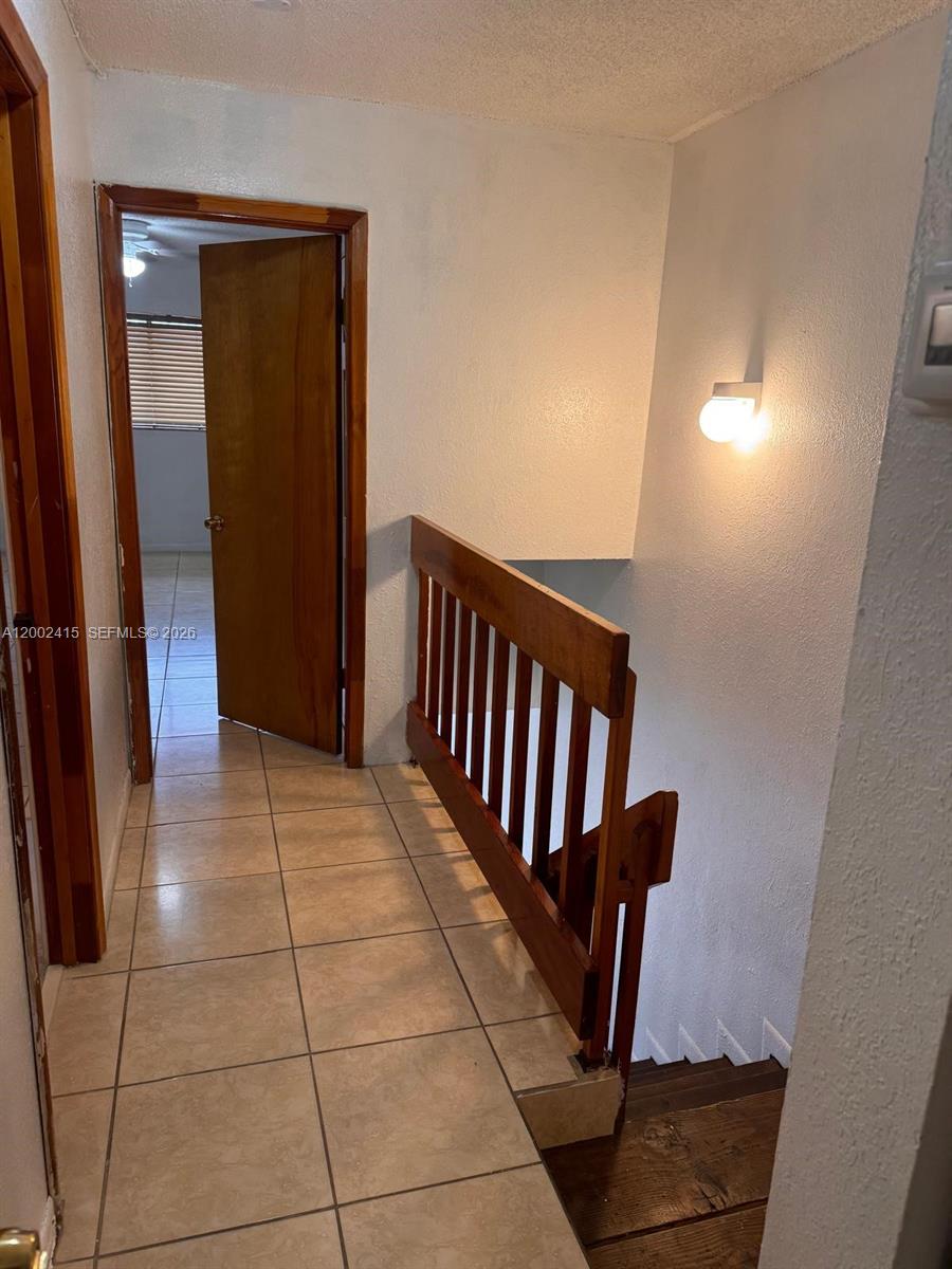 180 Royal Palm Road, Unit 216 Hialeah Gardens, FL 33016 - Photo 12 of 20 a view of entryway with stairs and a window