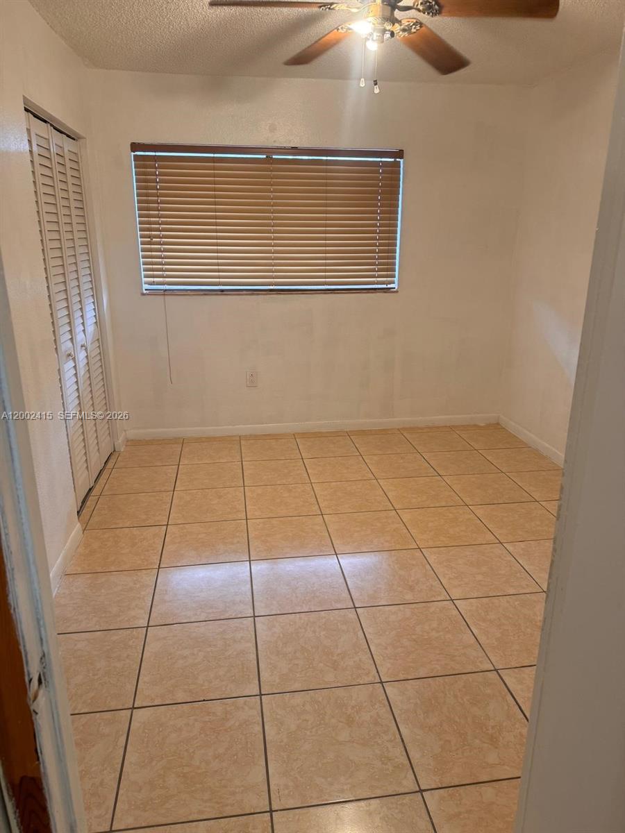 180 Royal Palm Road, Unit 216 Hialeah Gardens, FL 33016 - Photo 20 of 20 a view of an empty room with a window