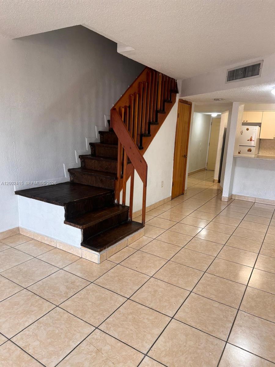 180 Royal Palm Road, Unit 216 Hialeah Gardens, FL 33016 - Photo 7 of 20 a view of entryway and hall