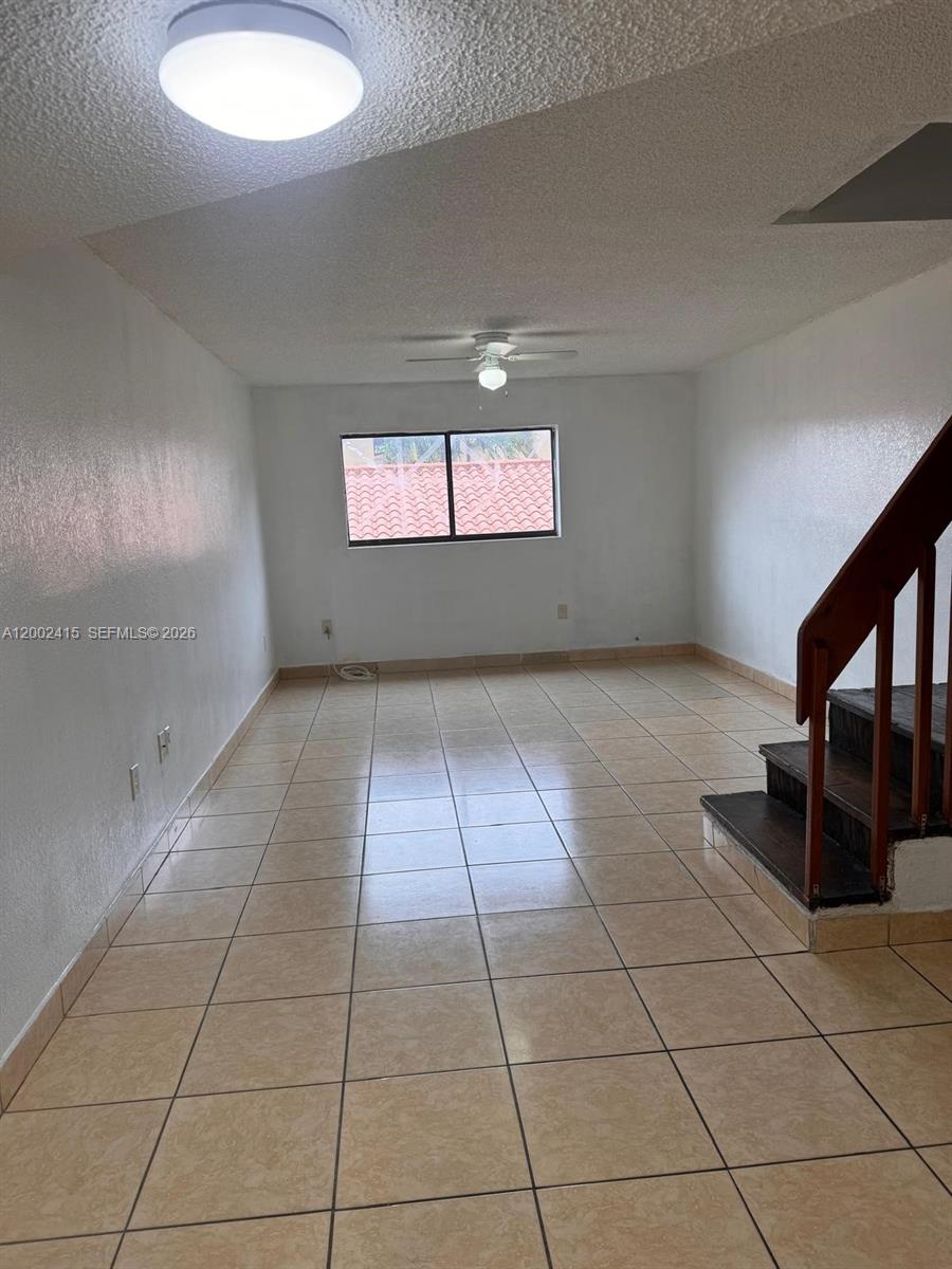 180 Royal Palm Road, Unit 216 Hialeah Gardens, FL 33016 - Photo 9 of 20 an empty room with windows
