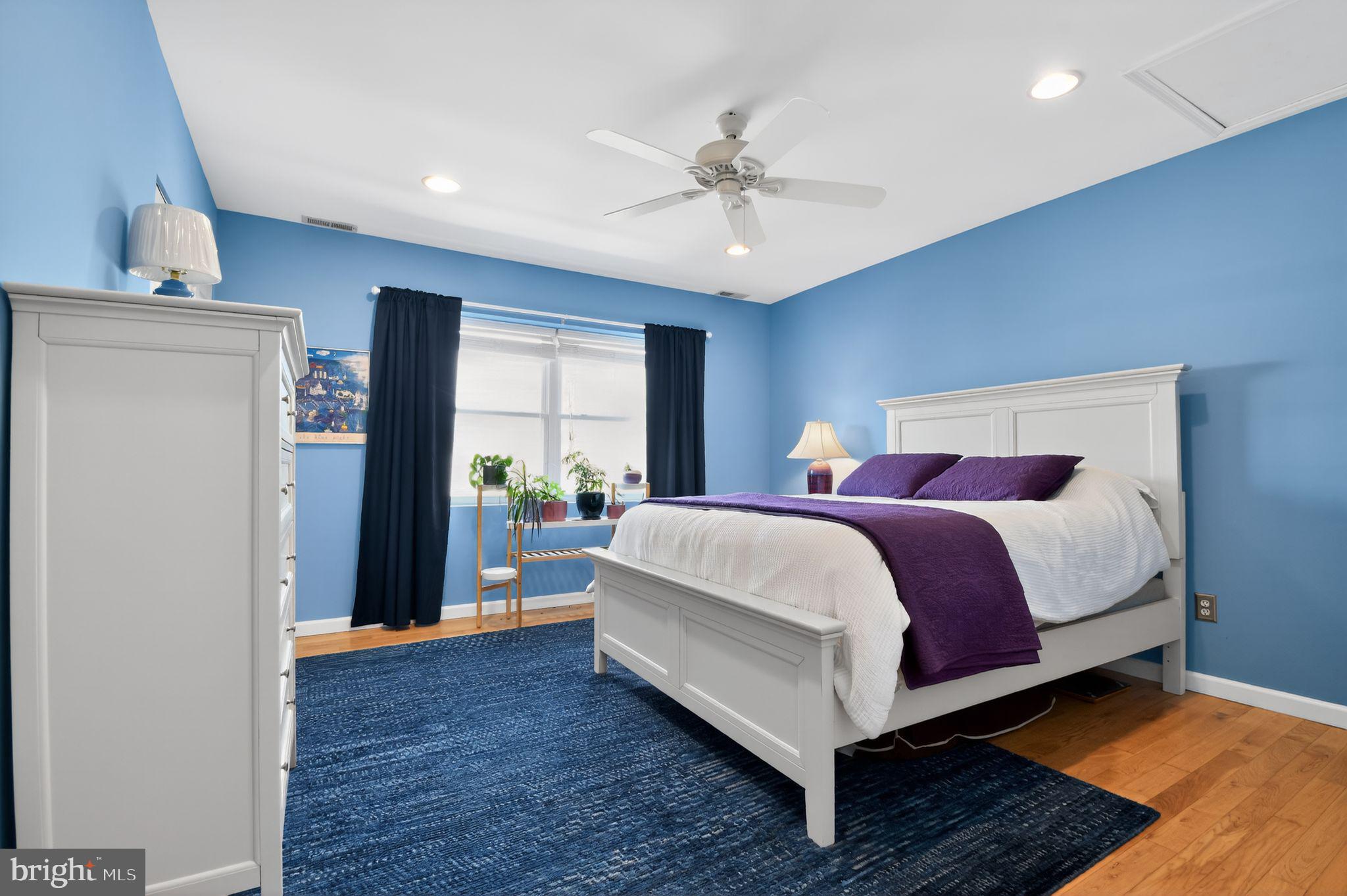 1227 Meigs Place Northeast, Unit C Washington, DC 20002 - Photo 14 of 17 a bed room with a bed and a chandelier