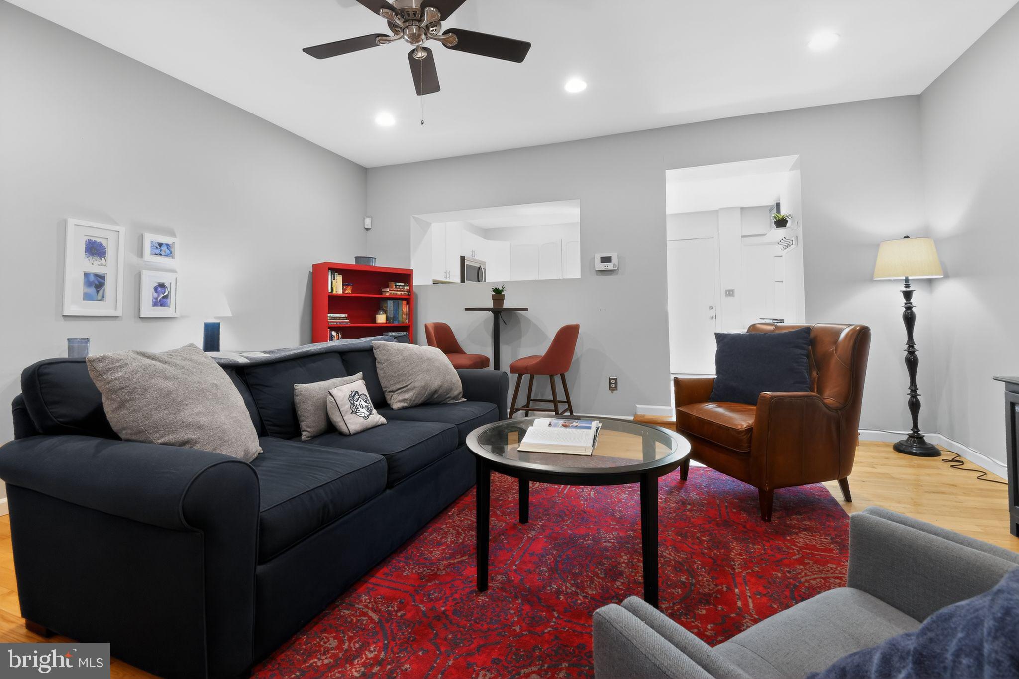 1227 Meigs Place Northeast, Unit C Washington, DC 20002 - Photo 4 of 17 a living room with furniture and a wooden floor