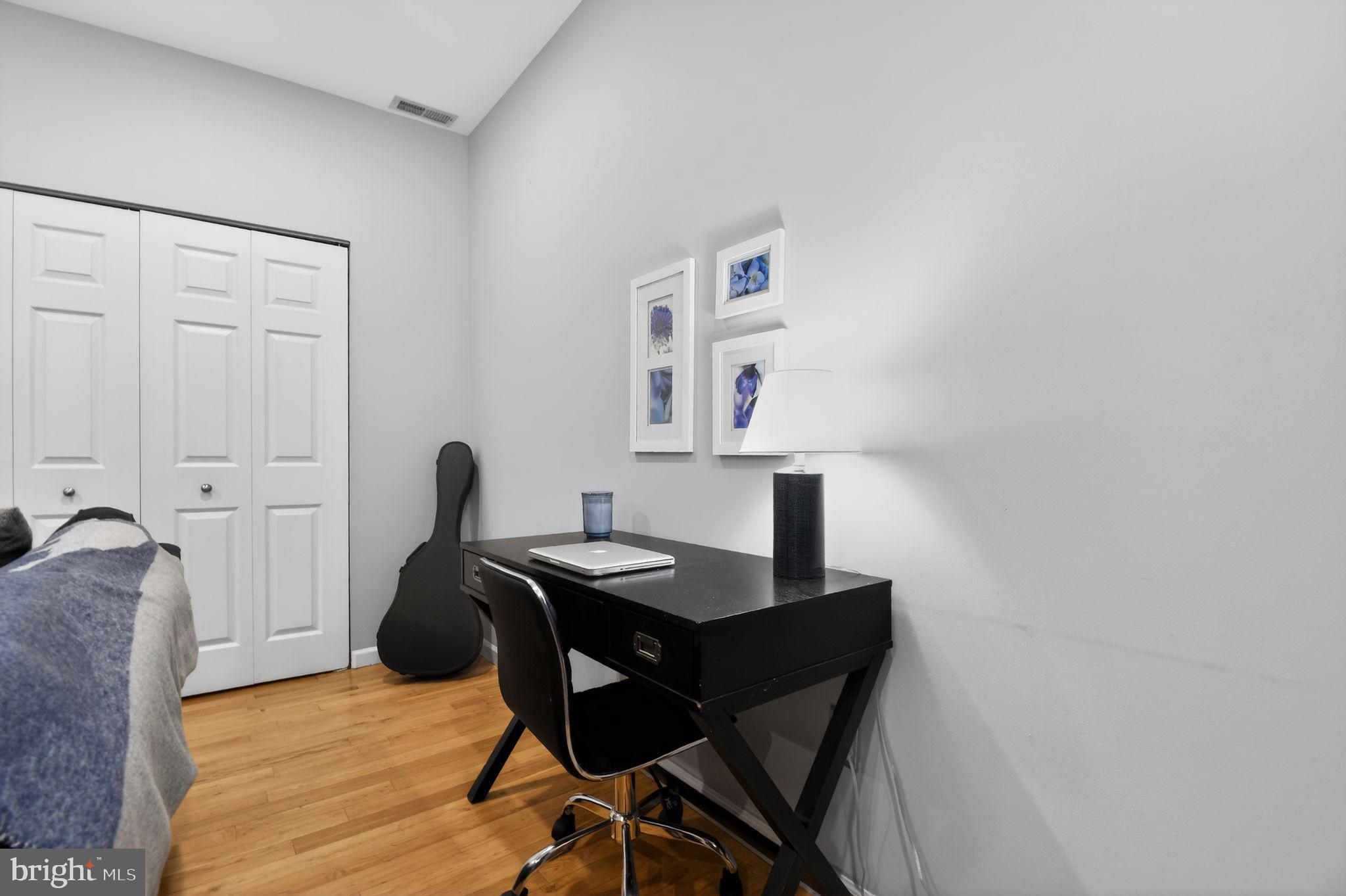 1227 Meigs Place Northeast, Unit C Washington, DC 20002 - Photo 10 of 17 a view of a workspace with furniture and wooden floor
