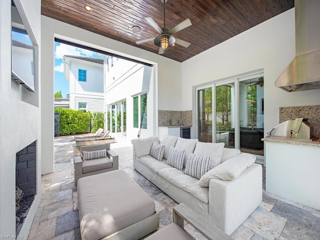 9200 Mercato Way Naples, FL 34108 - Photo 3 of 13 a living room with furniture and a large window