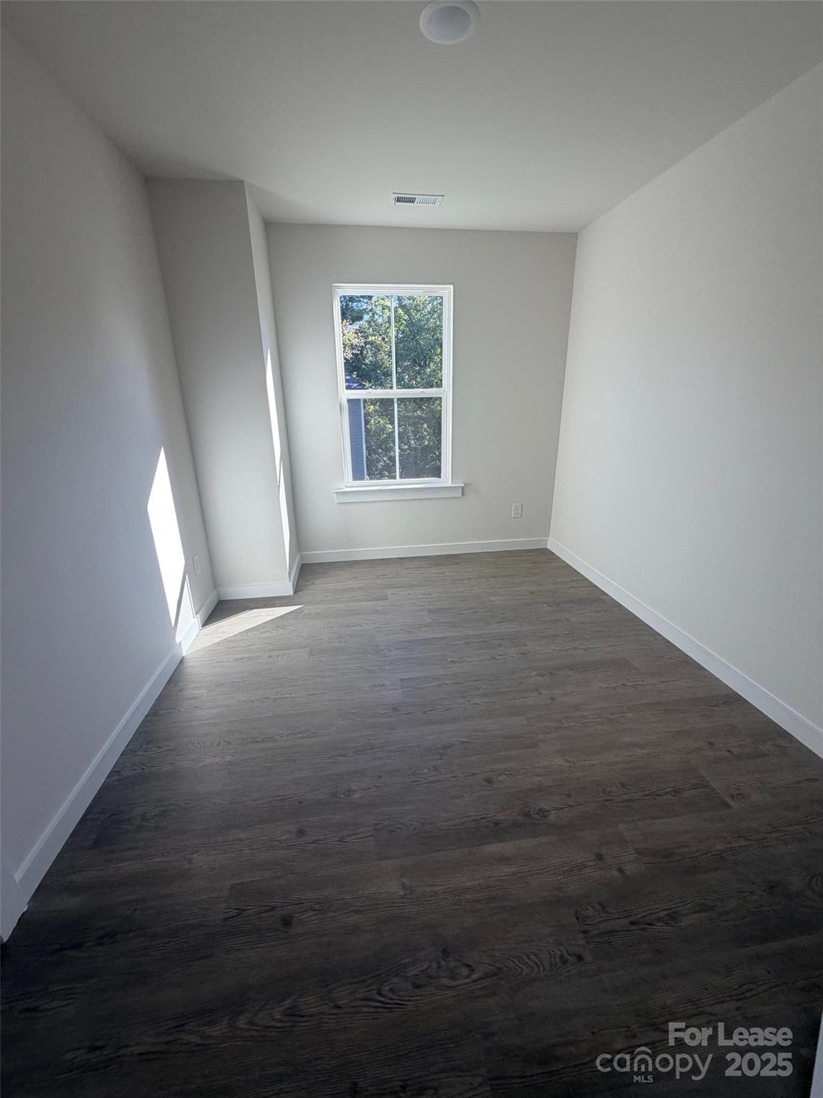 403 15th Avenue Southwest, Unit A Hickory, NC 28602 - Photo 10 of 10 wooden floor in an empty room with a window
