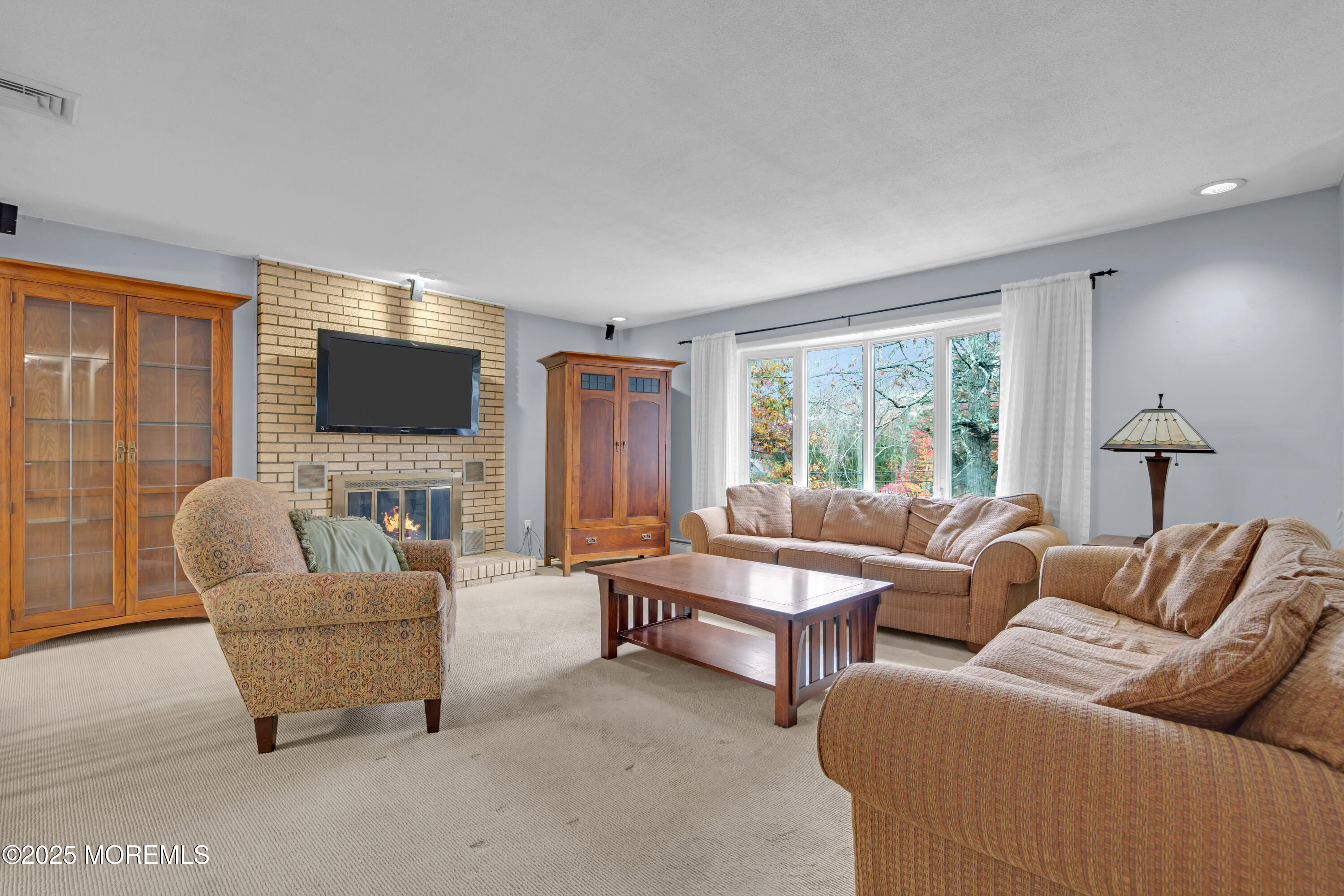 326 Jackson Pines Road Jackson, NJ 08527 - Photo 6 of 59 a living room with furniture and a flat screen tv