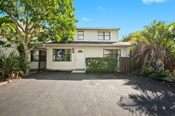 a view of a house with a yard and garage