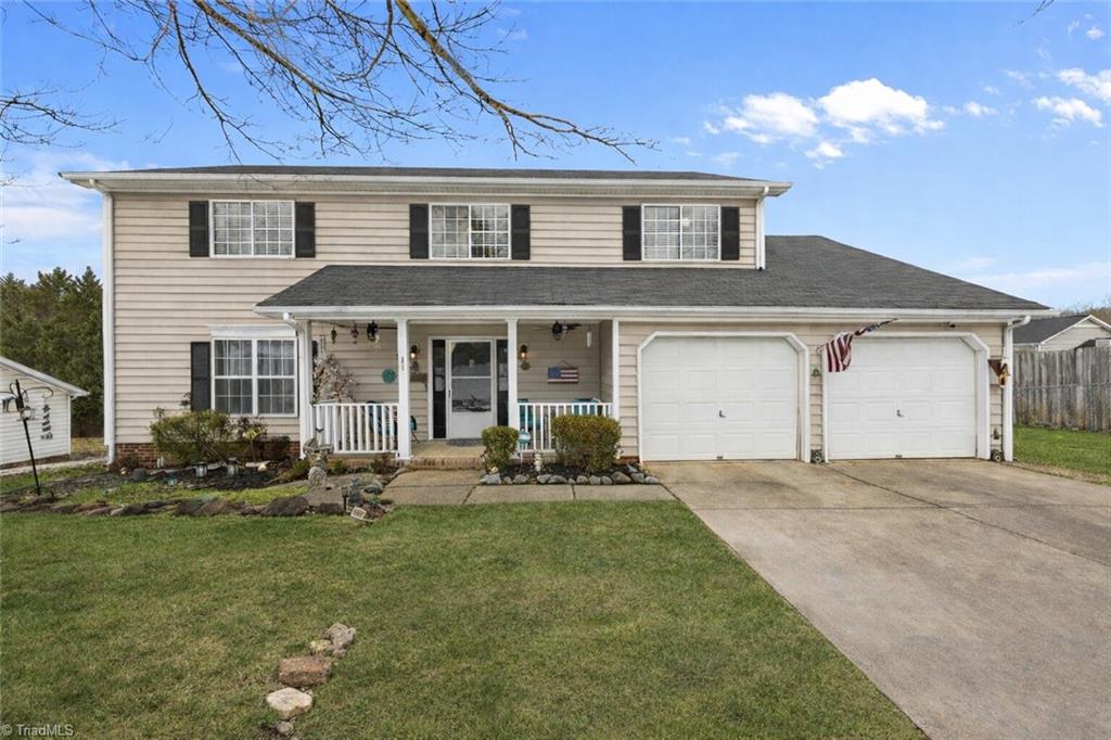 Virtually adjusted Front photo of the house to show grass