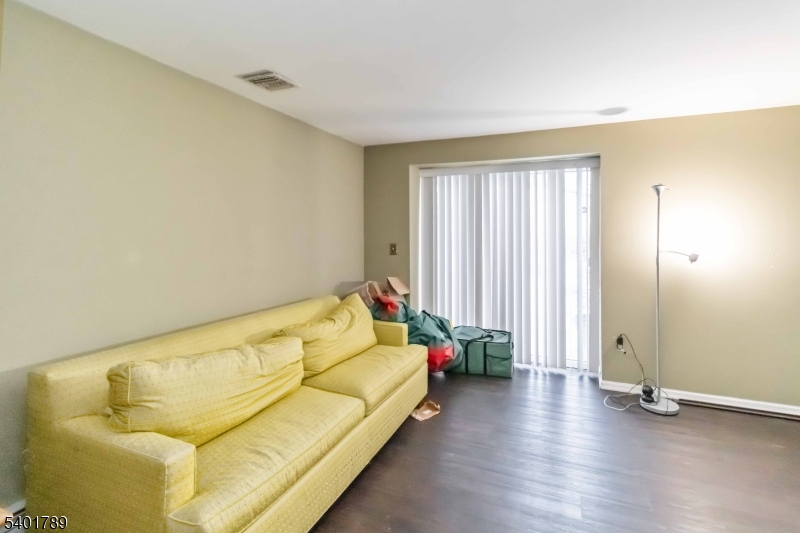 32 Heritage Way Dover, NJ 07801 - Photo 14 of 16 a bed sitting in a spacious bedroom next to a window