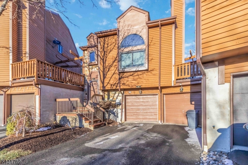 32 Heritage Way Dover, NJ 07801 - Photo 2 of 16 a view of a street with buildings in the background