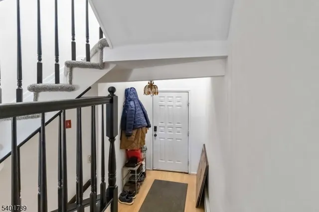 a view of a staircase with white walls
