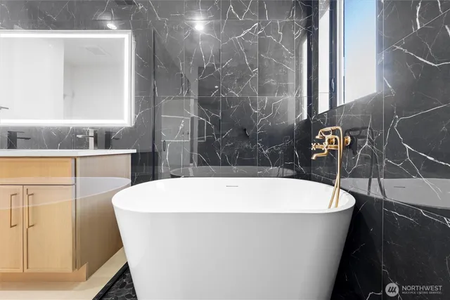 a white bath tub sitting in a bathroom