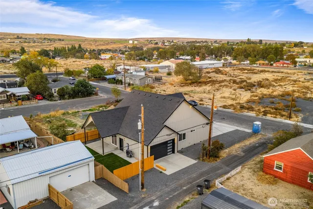an aerial view of residential houses with outdoor space