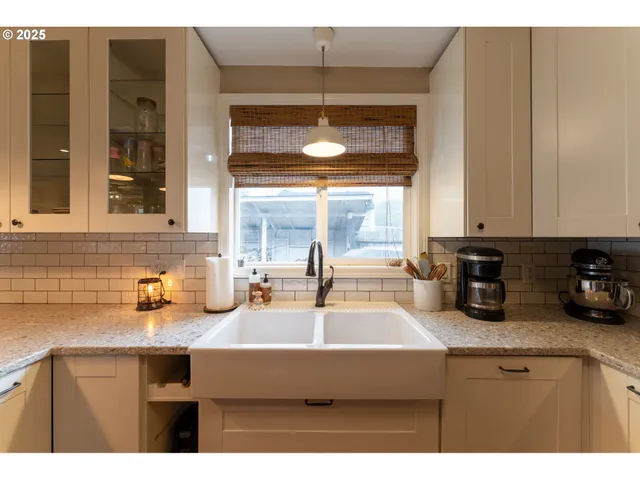 a kitchen with a sink and cabinets