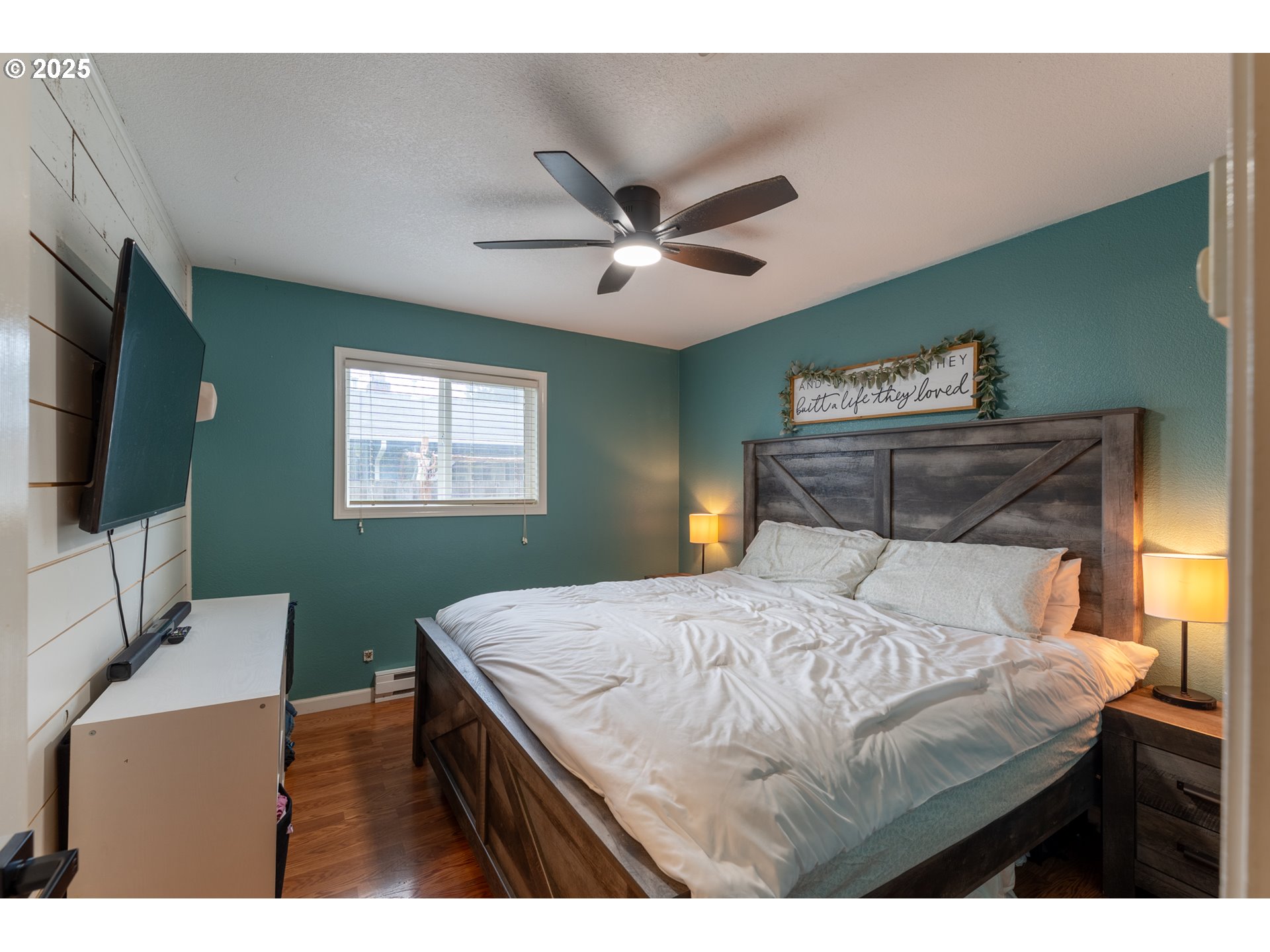 607 Getchell Avenue Amity, OR 97101 - Photo 17 of 33 a bedroom with a bed and a flat screen tv