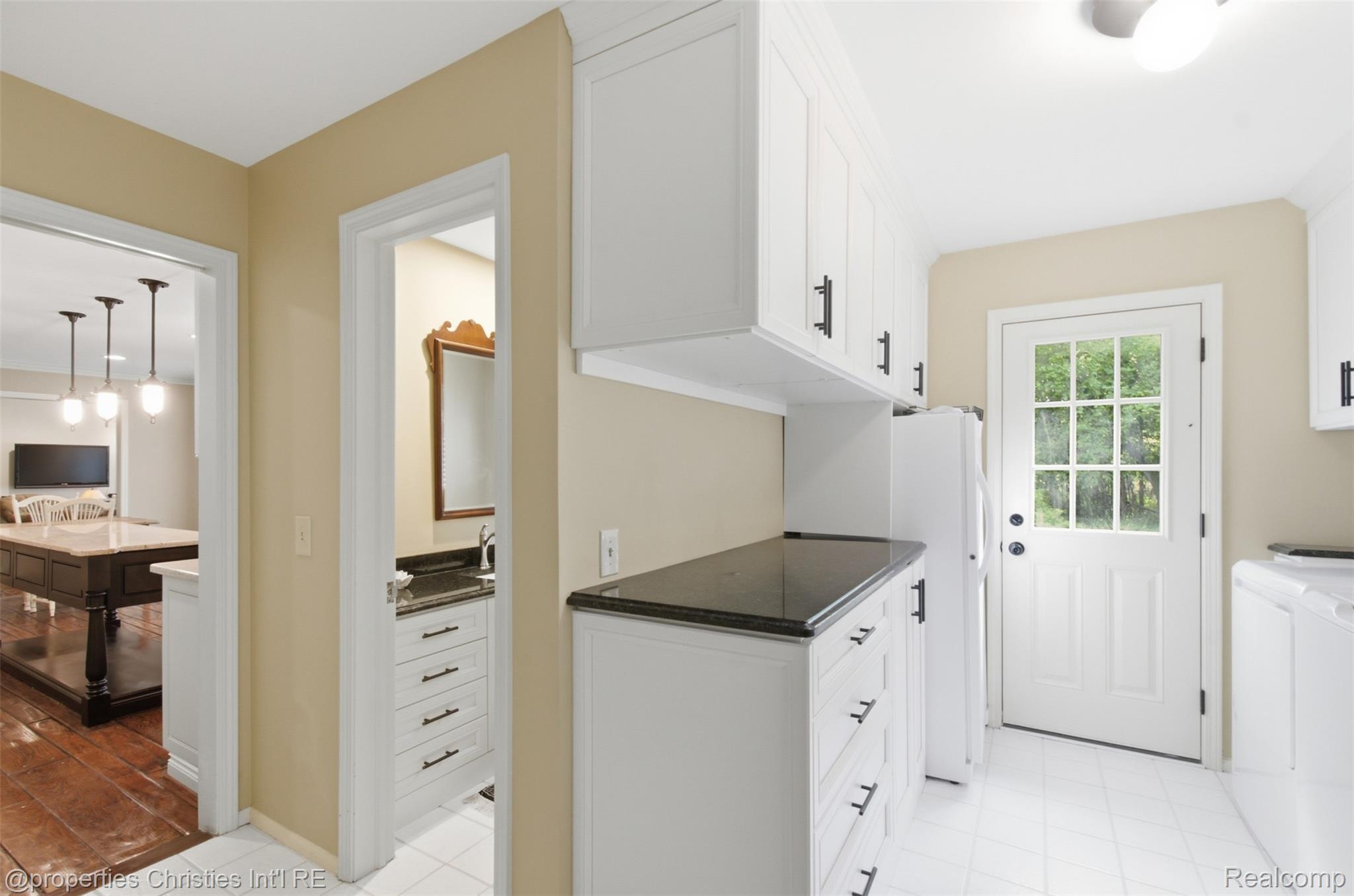 25235 Canterbury Road Franklin, MI 48025 - Photo 21 of 56 View from rear hallway of laundry room, family powder room and kitchen