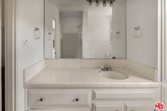 a bathroom with a sink and vanity