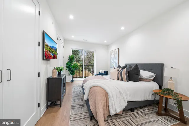 a bedroom with double bed and a window