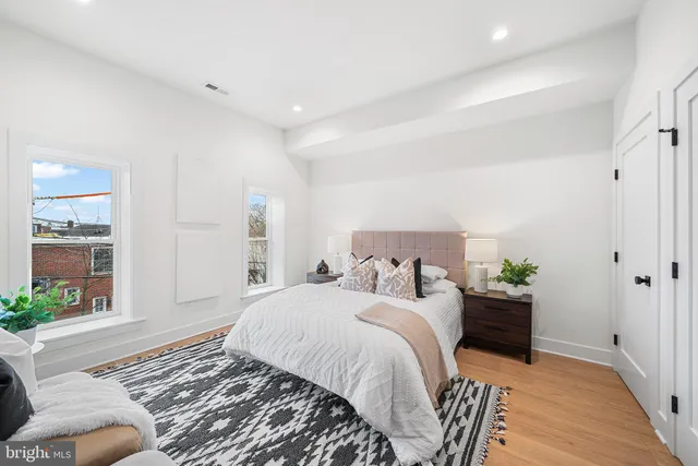 a bedroom with a bed and window