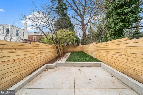 a view of a patio with a yard