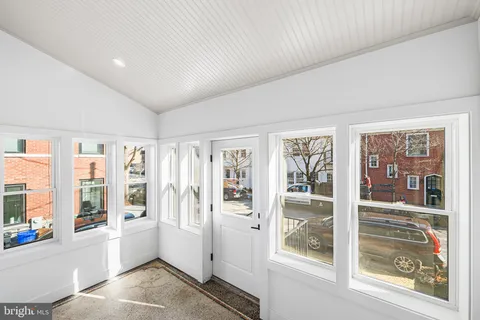 a living room with furniture and windows