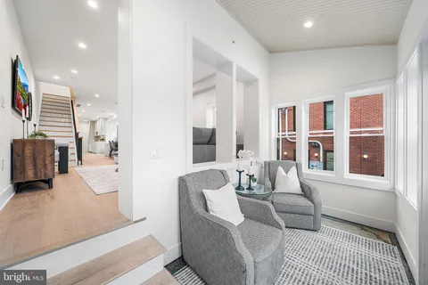 a living room with furniture and a rug