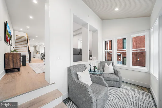 a living room with furniture and a rug