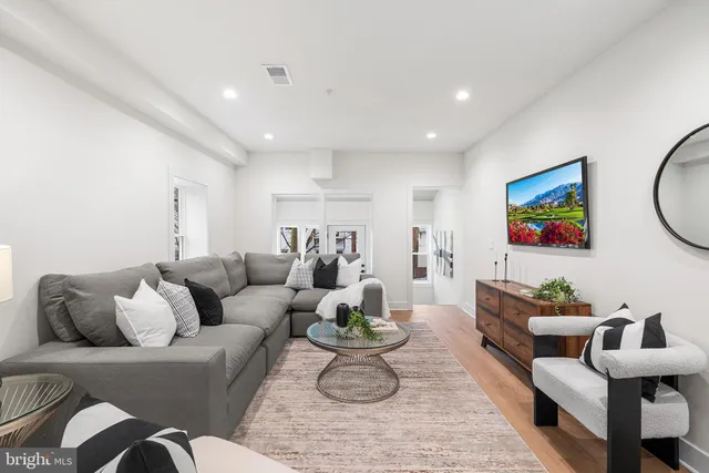a living room with furniture or couch and a flat screen tv