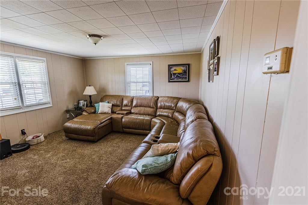 110 Edwards Road Mooresville, NC 28115 - Photo 12 of 39 a living room with furniture and a window