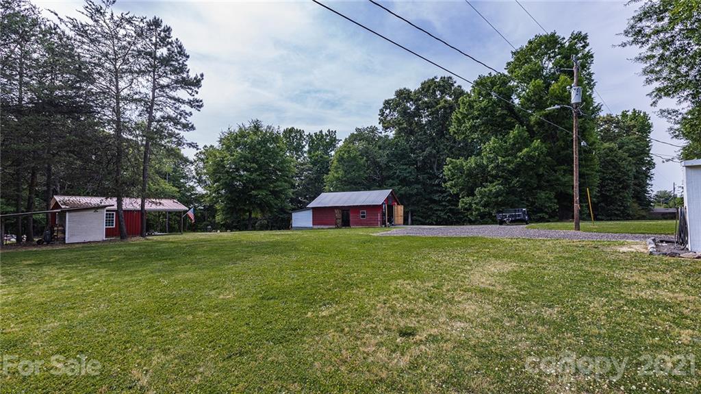 110 Edwards Road Mooresville, NC 28115 - Photo 13 of 39 a front view of a house with a yard and trees