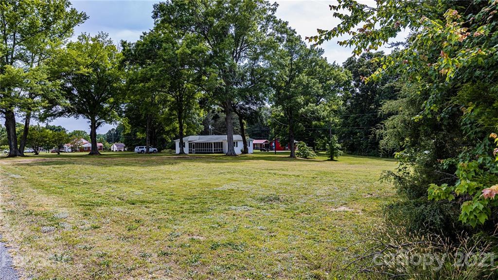 110 Edwards Road Mooresville, NC 28115 - Photo 17 of 39 a view of outdoor space with garden and trees