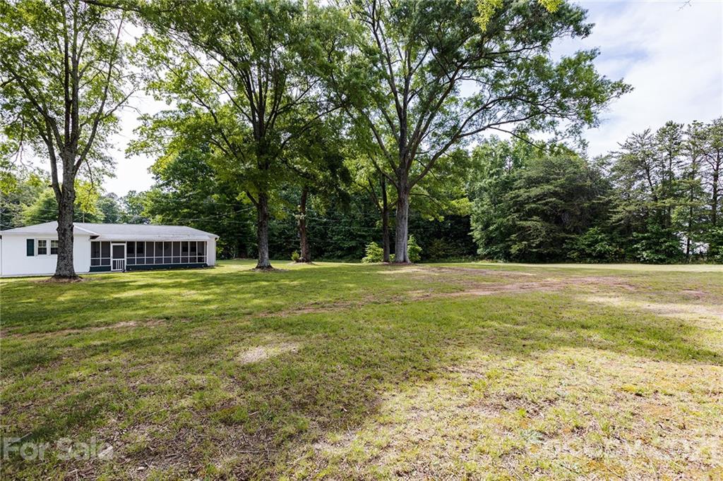 110 Edwards Road Mooresville, NC 28115 - Photo 18 of 39 a view of a house with a yard