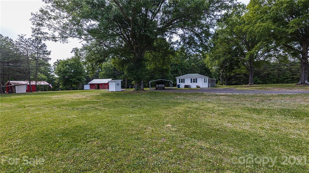 110 Edwards Road Mooresville, NC 28115 - Photo 19 of 39 a view of a trees with barn in the background