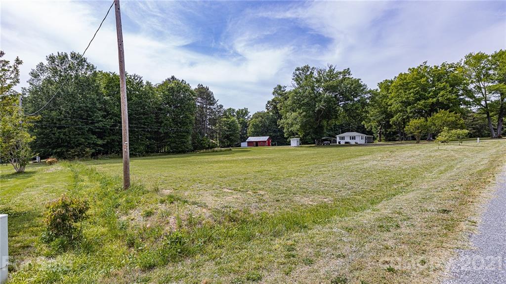 110 Edwards Road Mooresville, NC 28115 - Photo 20 of 39 a view of a field with a tree in the background