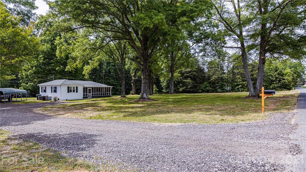 110 Edwards Road Mooresville, NC 28115 - Photo 21 of 39 a view of a house with swimming pool next to a yard