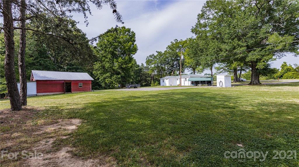 110 Edwards Road Mooresville, NC 28115 - Photo 29 of 39 a house view with a sitting space and garden view