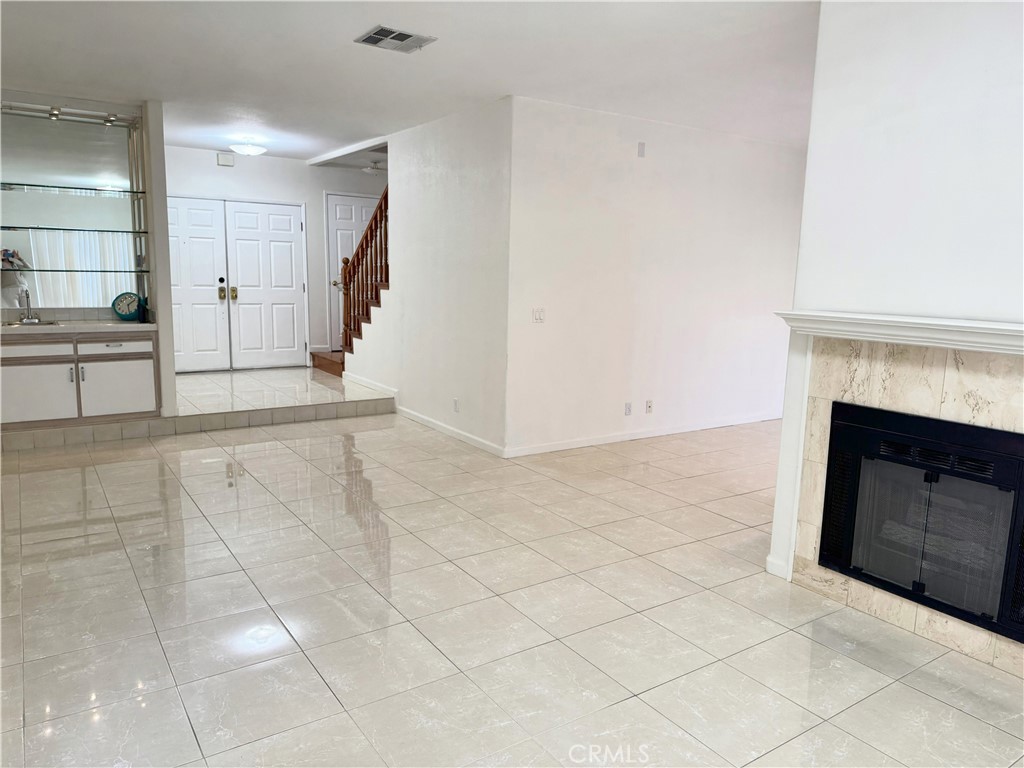 18319 Hart Street, Unit 3 Reseda, CA 91335 - Photo 9 of 18 a view of a livingroom with an empty space and a fireplace
