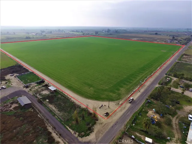 a view of a back yard of a house with a yard