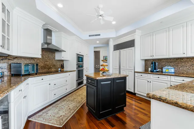 a view of an chairs and tables in the balcony