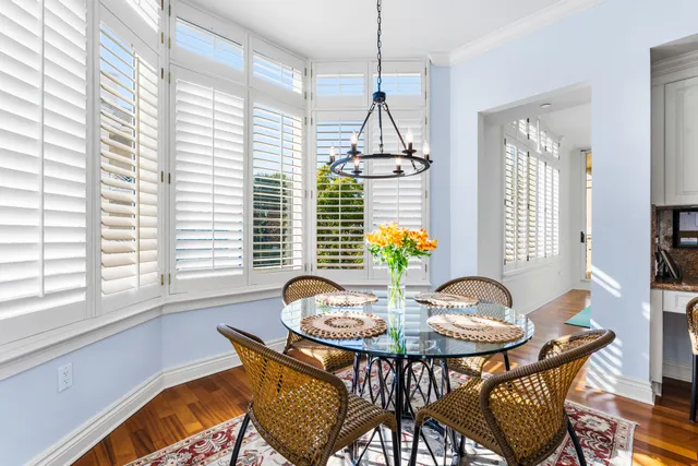 a hallway with cabinets and wooden floor
