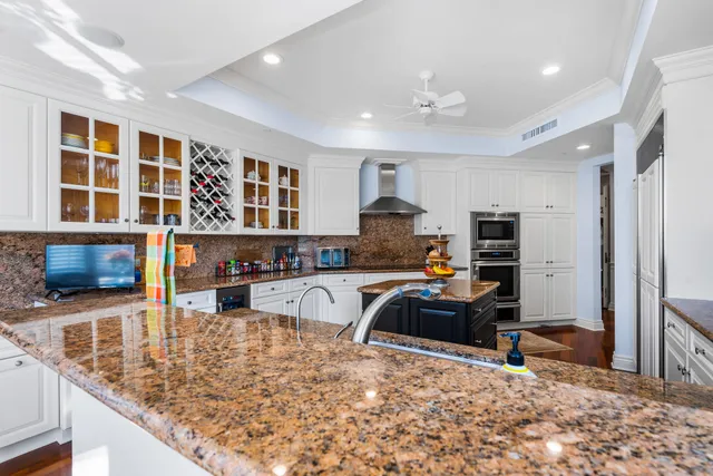 a view of hall way with furniture and wooden floor
