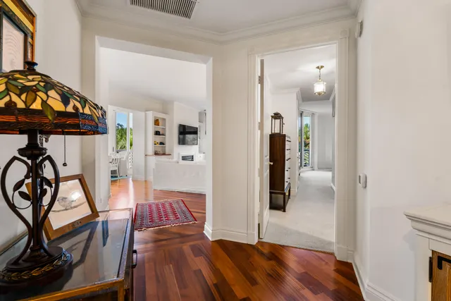 a bathroom with a sink vanity mirror and toilet