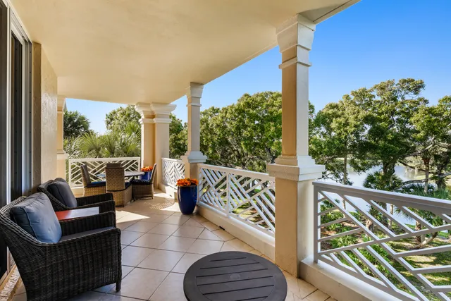 a view of living room with furniture and a floor to ceiling window