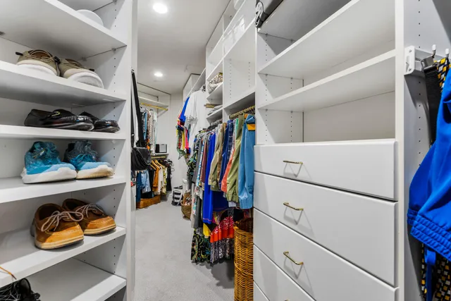 an aerial view of residential houses with city view